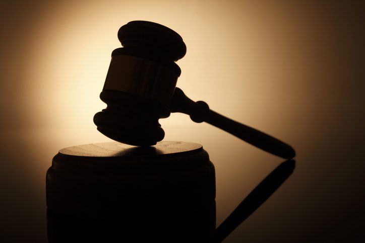 A silhouette of a gavel.